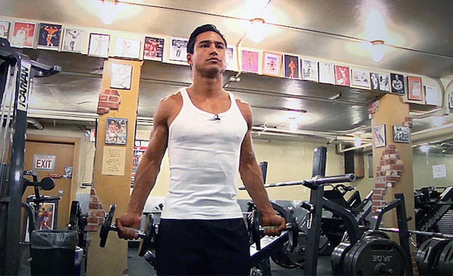 Mario Lopez doing bicep curls